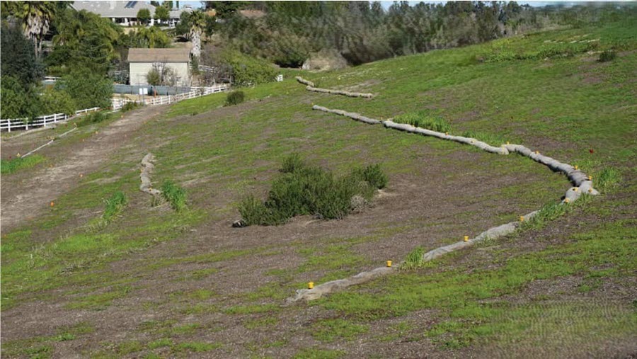 Fiber rolls installed along a graded slope